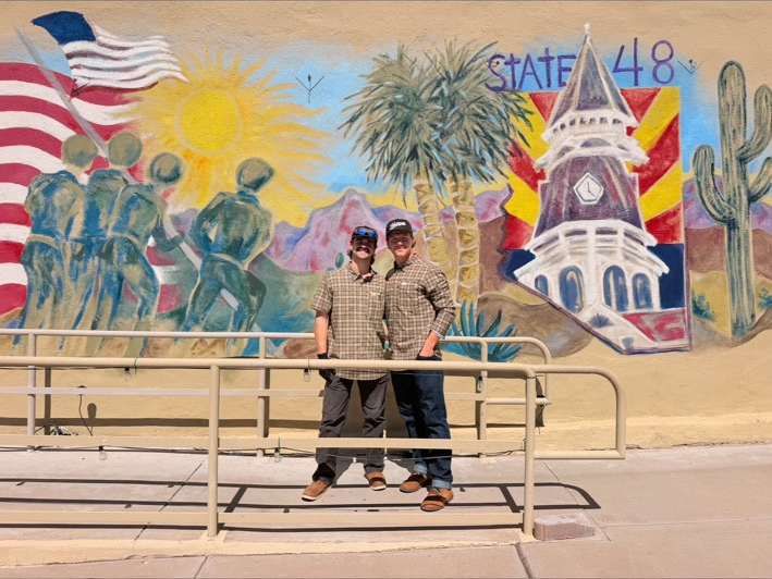 Keegan and Ryland in front of the STATE48 mural